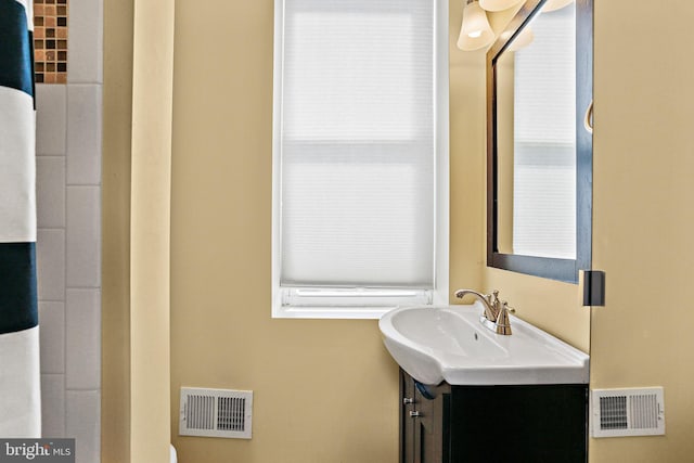 bathroom with visible vents and vanity