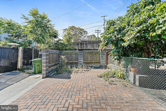 view of patio / terrace featuring fence