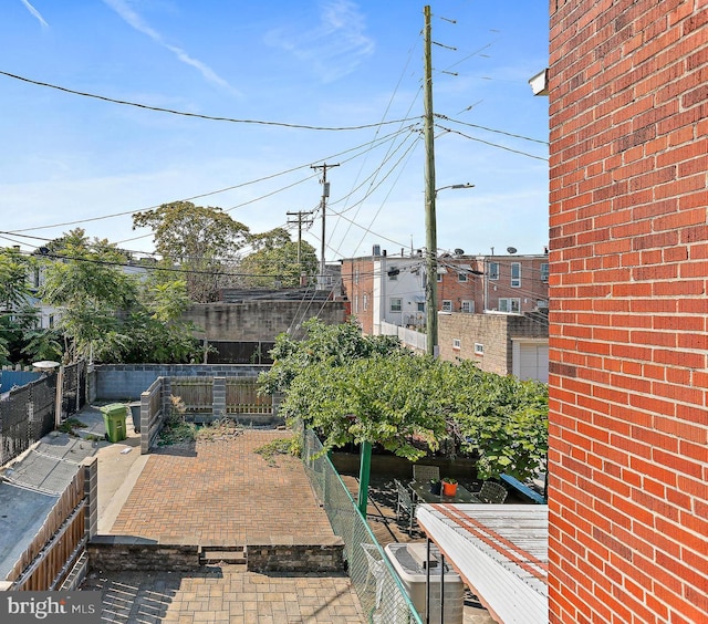 view of patio featuring fence