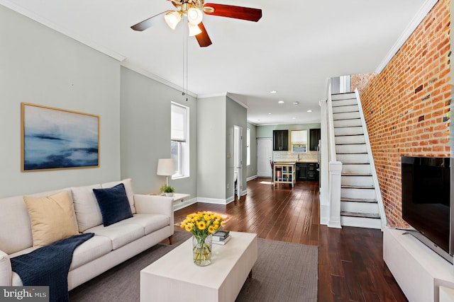 living room with baseboards, dark wood finished floors, ornamental molding, stairs, and recessed lighting