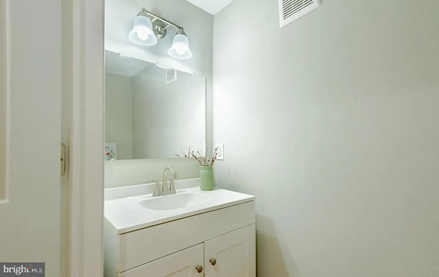 bathroom with visible vents and vanity