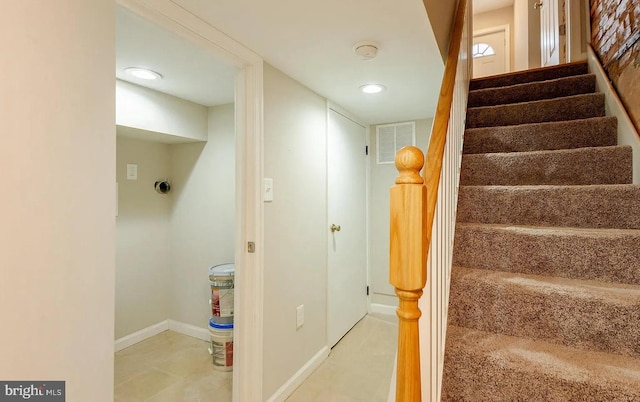 stairs featuring baseboards and visible vents