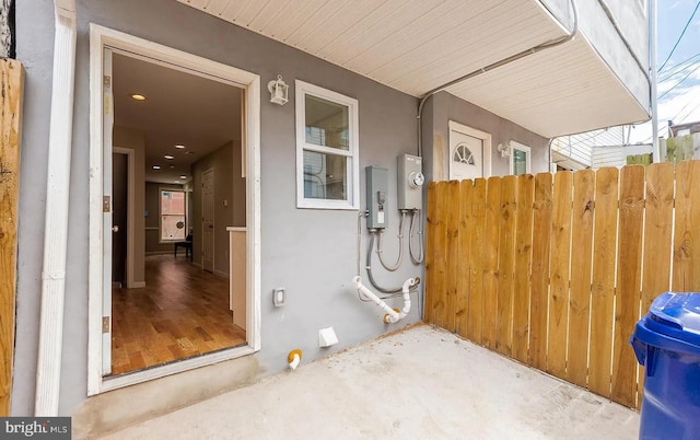 exterior space with fence and stucco siding