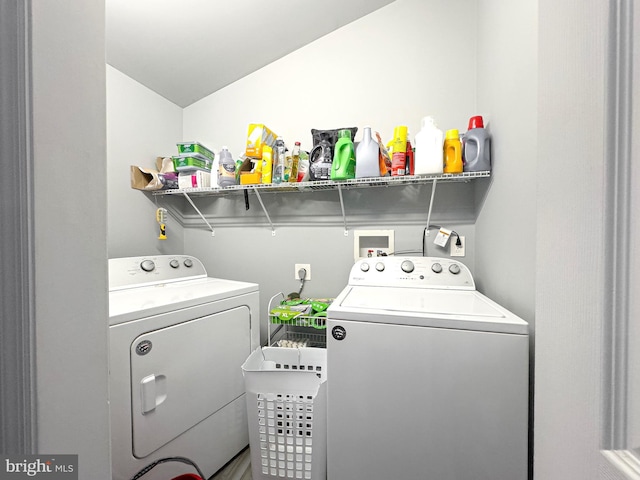 clothes washing area with laundry area and washer and dryer