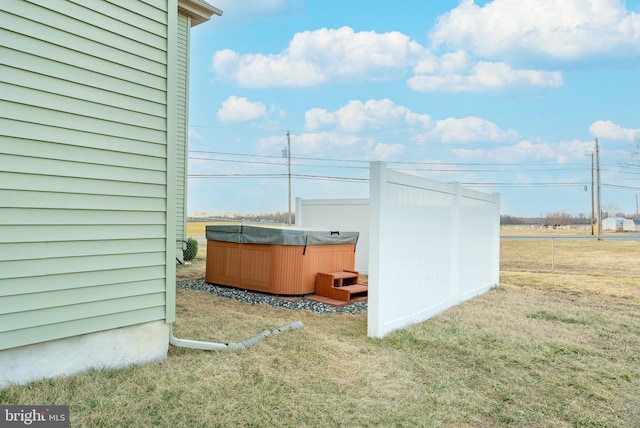 exterior space featuring a hot tub