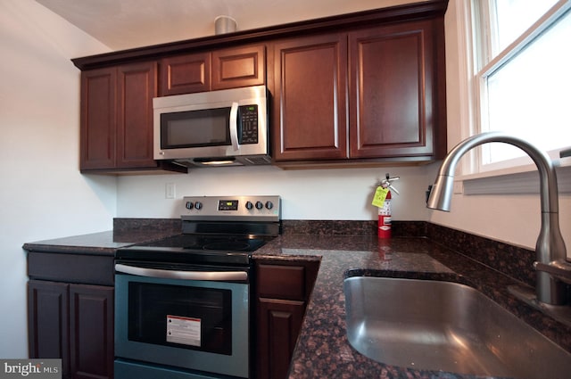 136 W Lytle Ave, State College, PA 16801 - kitchen featuring stainless steel appliances, a sink, and dark stone counters