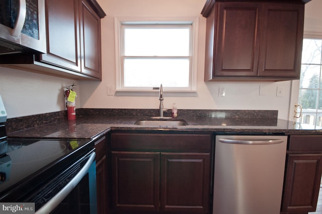 136 W Lytle Ave, State College, PA 16801 - kitchen with stainless steel appliances, a sink, and dark stone countertops