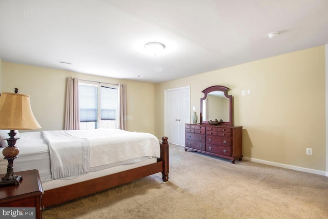 bedroom featuring carpet floors and baseboards