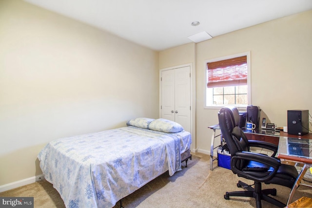 bedroom with carpet flooring and baseboards