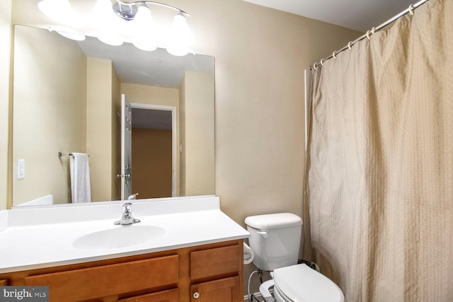 bathroom with toilet and vanity