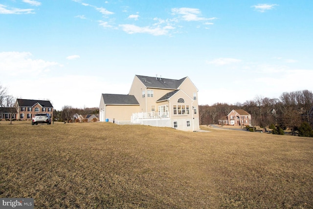 back of house with a yard