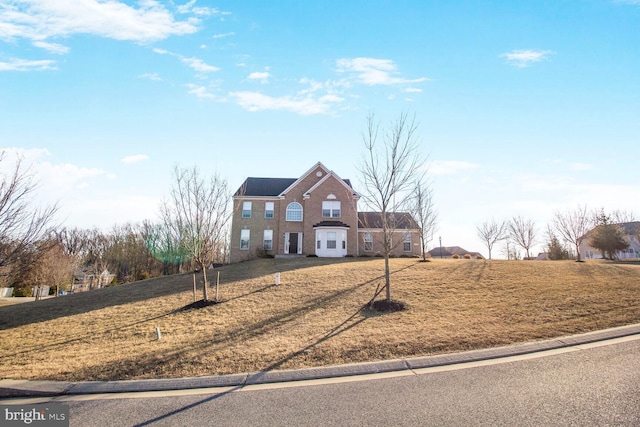 view of front of home with a front lawn