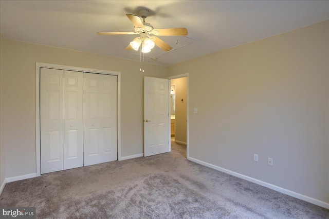 unfurnished bedroom featuring baseboards, a closet, carpet floors, and ceiling fan