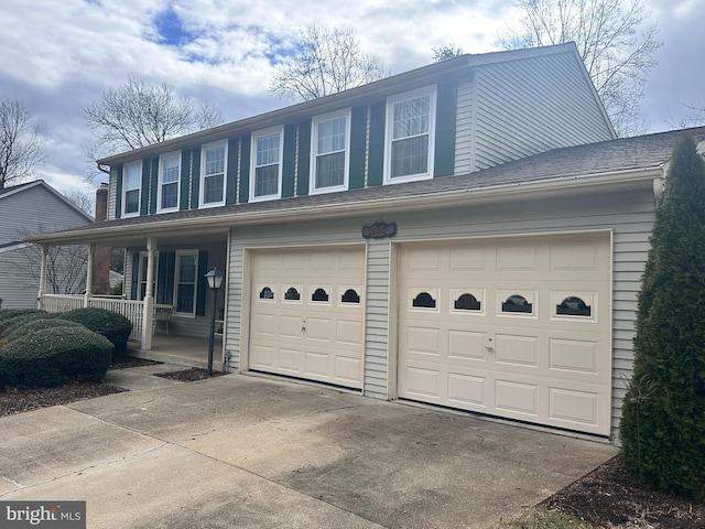 view of side of property with covered porch and driveway