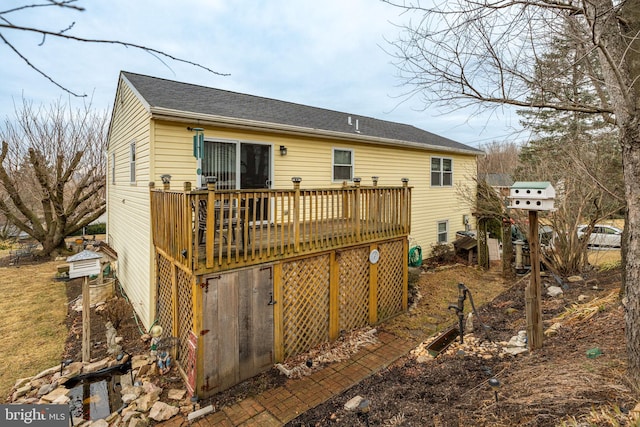 rear view of house featuring a deck