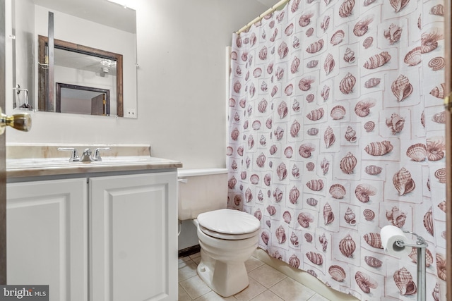 full bath featuring toilet, a shower with curtain, vanity, and tile patterned floors