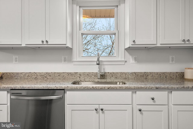 kitchen featuring a sink, light stone countertops, white cabinets, and dishwasher