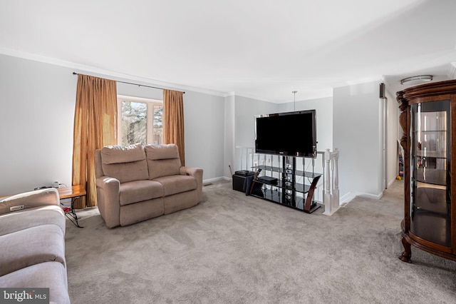 carpeted living area featuring crown molding and baseboards