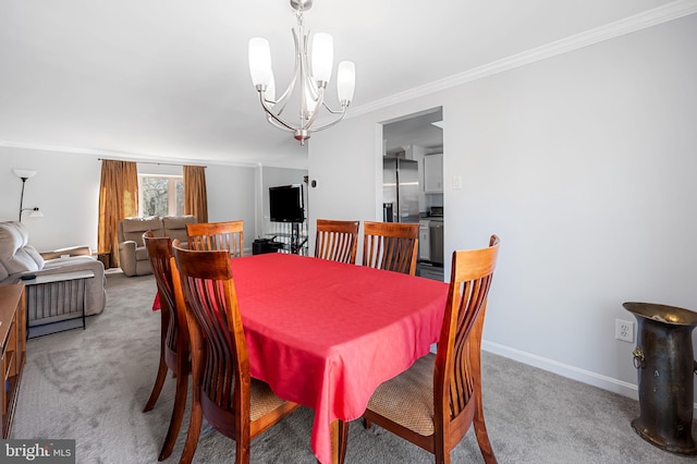 dining area featuring carpet flooring, an inviting chandelier, baseboards, and ornamental molding