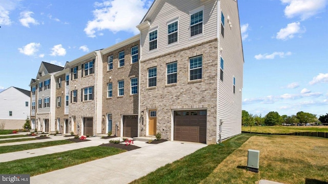 multi unit property featuring a garage, concrete driveway, brick siding, and a front lawn