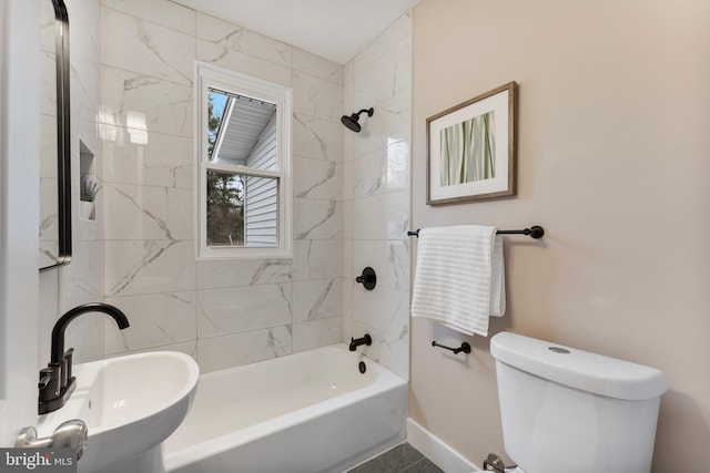 full bathroom with toilet, bathtub / shower combination, baseboards, and a sink