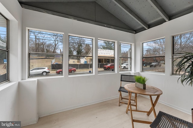 sunroom featuring lofted ceiling