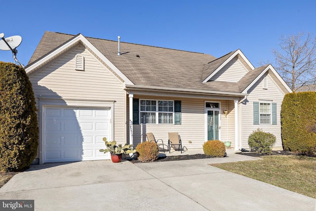 view of front facade featuring an attached garage, concrete driveway, and roof with shingles