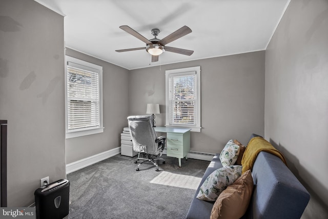 office area with a baseboard heating unit, baseboards, a ceiling fan, and carpet flooring