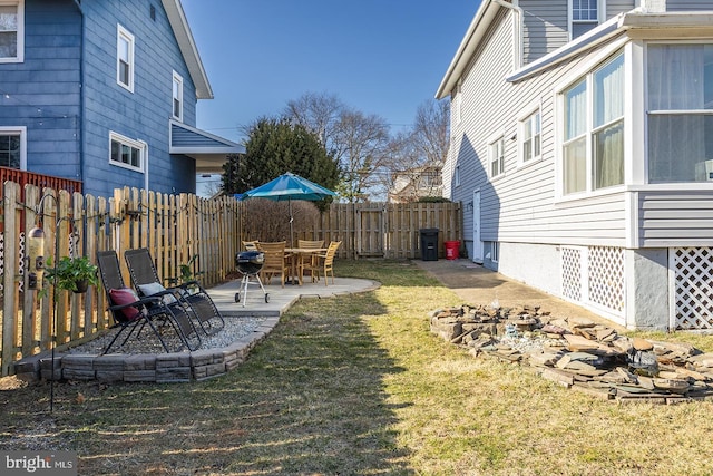 view of yard with a patio area and a fenced backyard