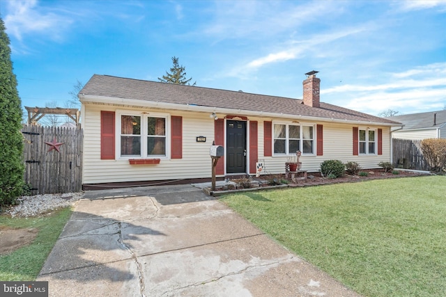 ranch-style home featuring a chimney, roof with shingles, a front lawn, and fence