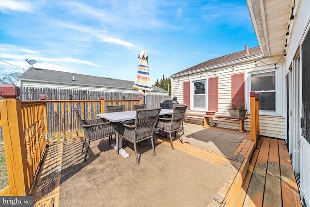 wooden deck with outdoor dining space