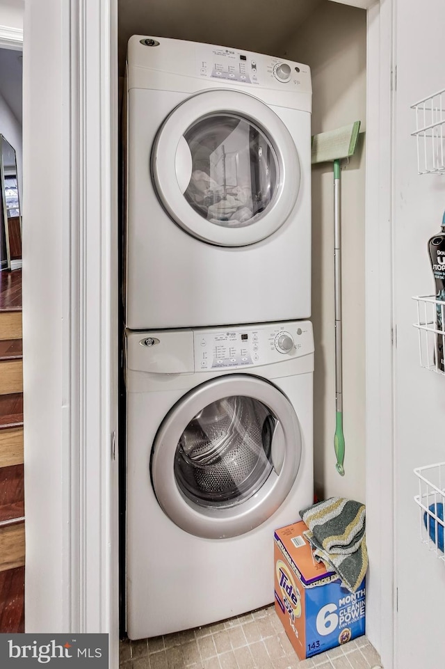 laundry area with laundry area and stacked washing maching and dryer