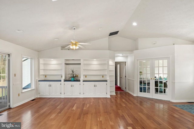 kitchen featuring open shelves, french doors, light wood-type flooring, and visible vents