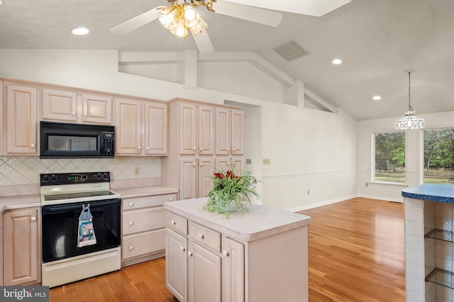 kitchen featuring visible vents, light countertops, electric stove, and black microwave