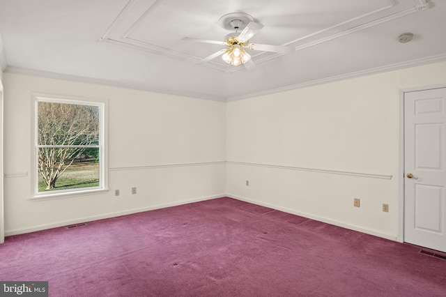 unfurnished room featuring crown molding, attic access, carpet flooring, and visible vents