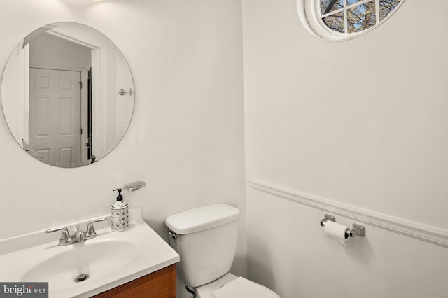 bathroom with toilet and vanity