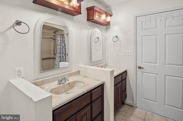 full bathroom featuring tile patterned flooring, curtained shower, and vanity