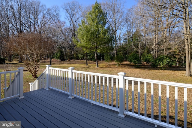 wooden deck with a yard