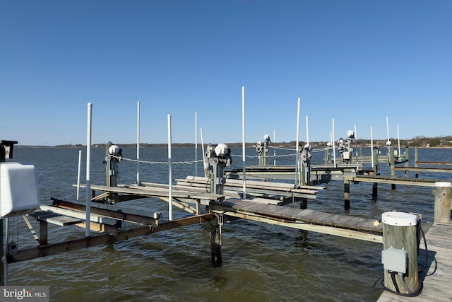 view of dock featuring a water view and boat lift