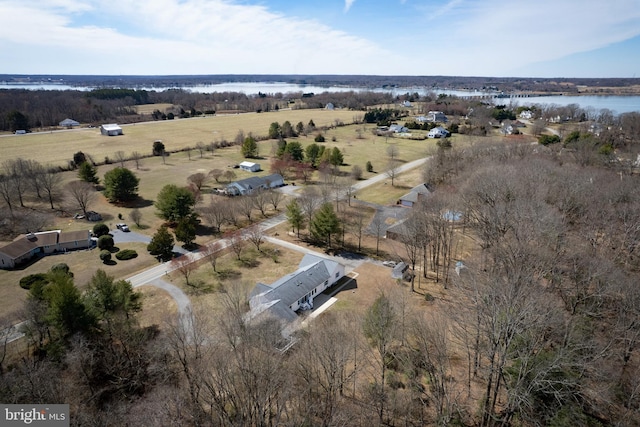 birds eye view of property with a rural view and a water view