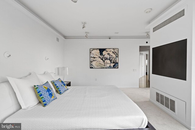 carpeted bedroom featuring visible vents