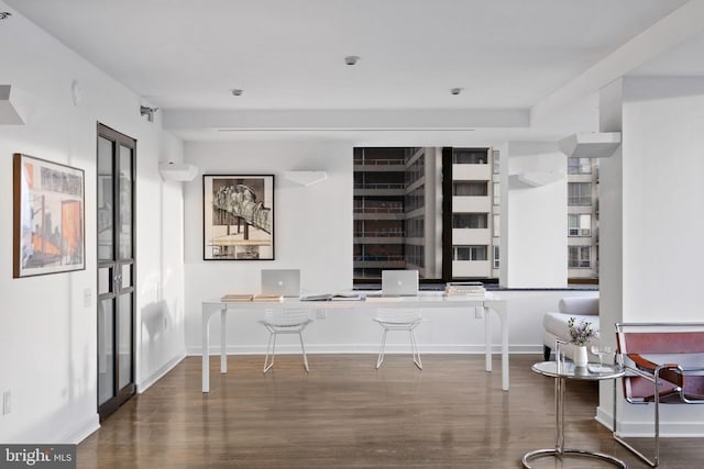 office space featuring wood finished floors and baseboards