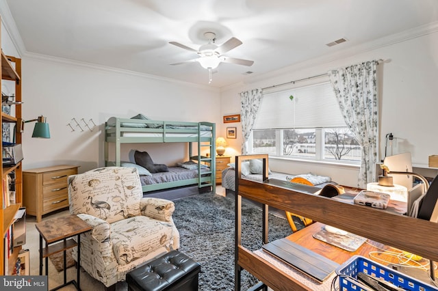 bedroom with ceiling fan, visible vents, and ornamental molding