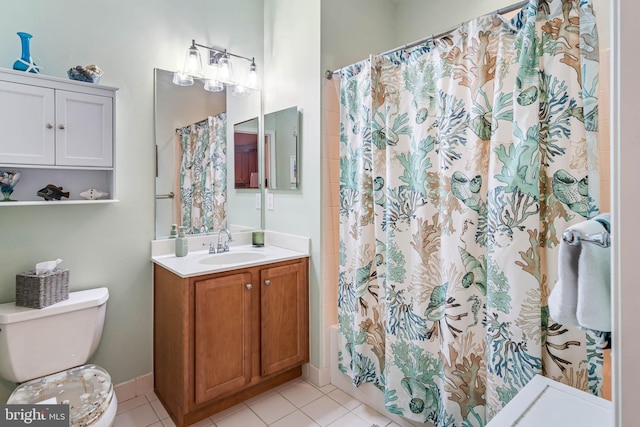 bathroom featuring tile patterned floors, toilet, vanity, and a shower with shower curtain