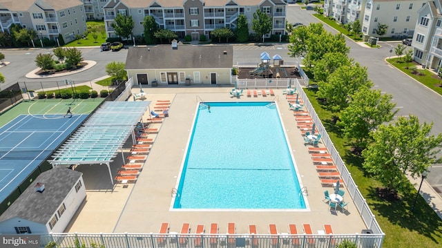 view of swimming pool with fence