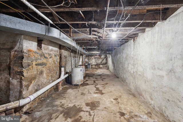 unfinished basement with water heater