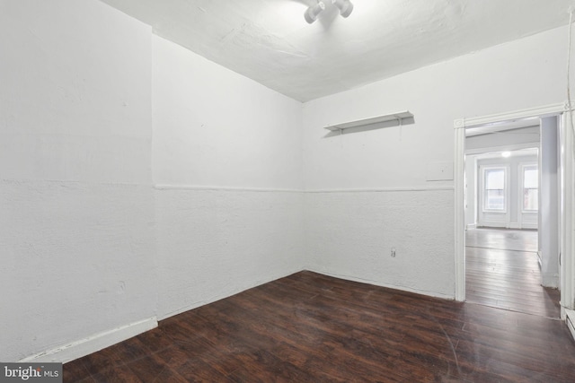 unfurnished room featuring hardwood / wood-style flooring