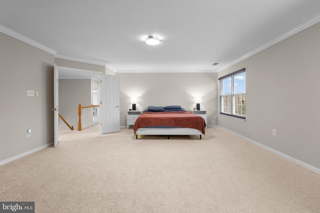 bedroom featuring ornamental molding, carpet, and baseboards