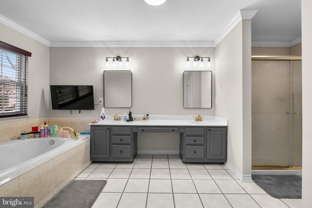 full bathroom with double vanity, a stall shower, crown molding, and tile patterned floors