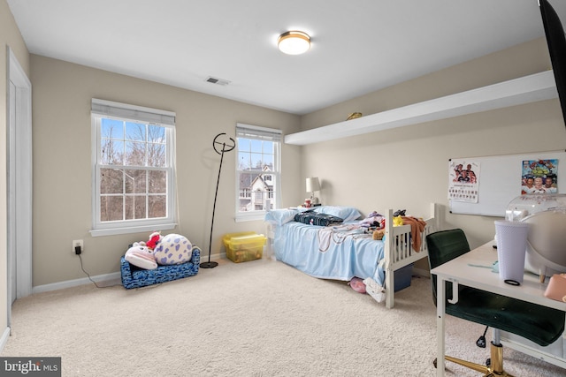 bedroom featuring baseboards, visible vents, and carpet flooring